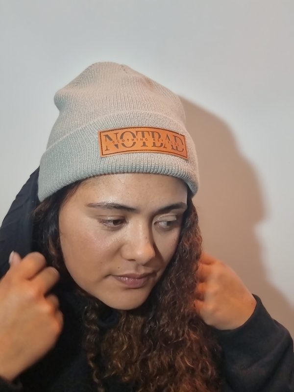 Model wearing not bad beanie in grey